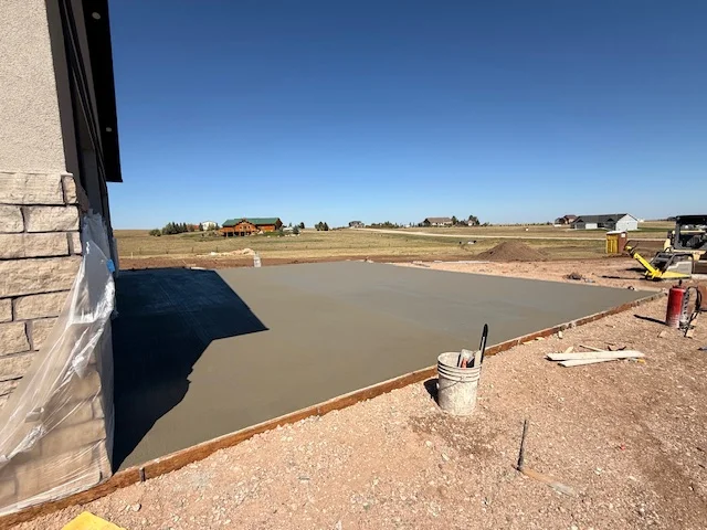 Fresh concrete slab poured for garage pad, southeast Wyoming