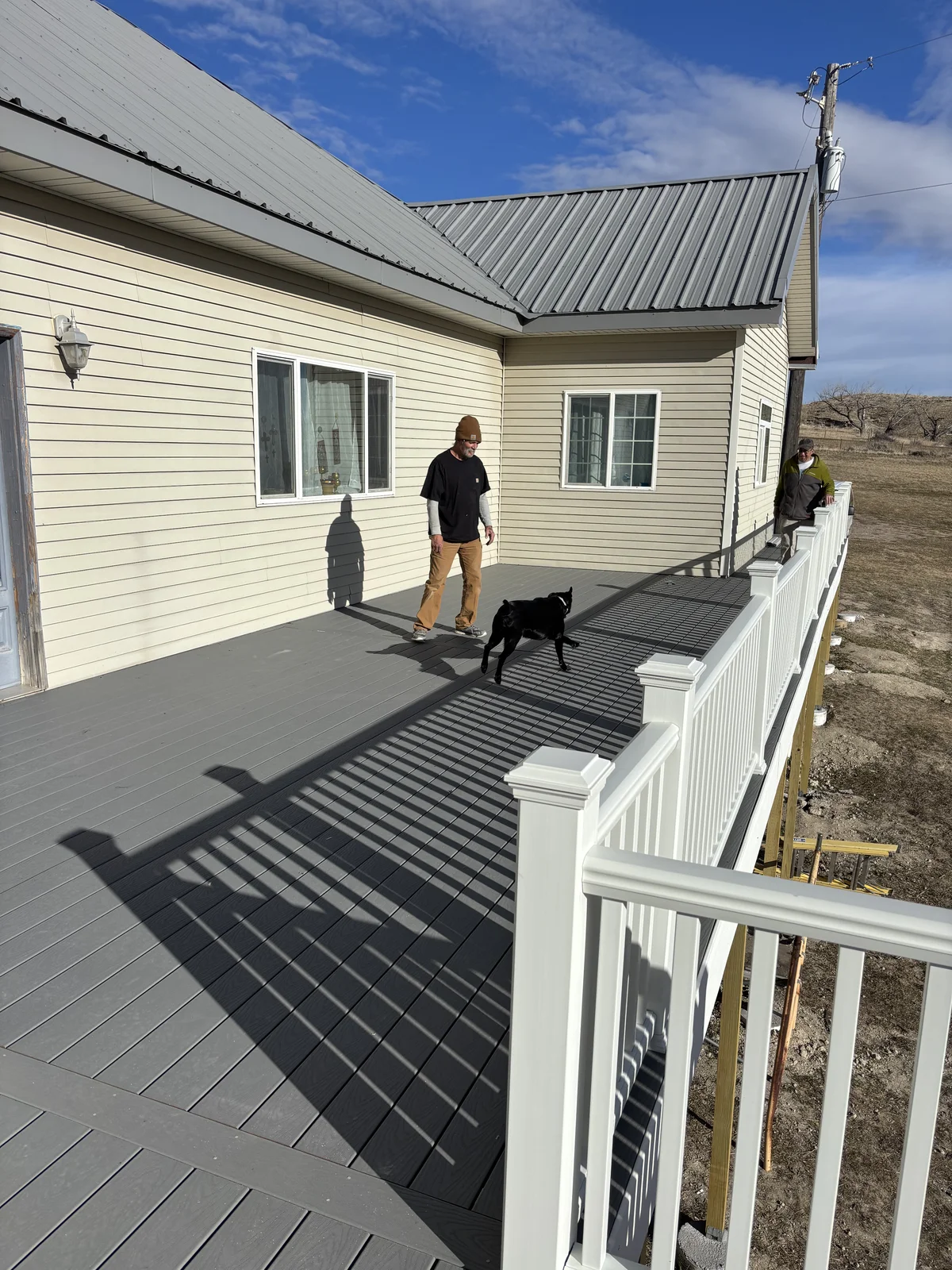 Finished composite deck with white railings on Wyoming home, Cheyenne WY